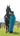 EQUIDRY women's long waterproof horse riding coat in turquoise stood with horse