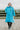 EQUIDRY Evolution Lux Women's Warm Waterproof Winter Horse Riding Coat Thick Fleece Lining with Faux Fur Trim Hood in turquoise rider in arena