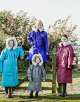 EQUIDRY Evolution Lux children's Warm Waterproof Winter Horse Riding Coat Thick Fleece Lining with Faux Fur Trim Hood being shown in purple, turquoise, plum/ charcoal/grey 