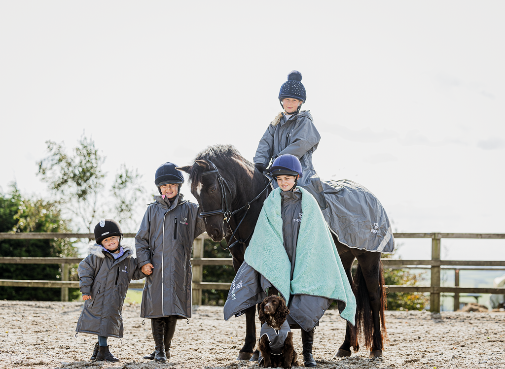 EQUIDRY waterproof horse riding raincoat thin fleece pro ride reflective in charcoal/pale pink children's grey family photo in arena 