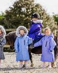 EQUIDRY Evolution Lux children's Warm Waterproof Winter Horse Riding Coat Thick Fleece Lining with Faux Fur Trim Hood being shown in purple, sky blue, charcoal/pale pink with kids on horse 