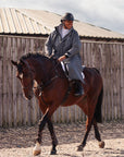 EQUIDRY Pro ride Evolution equestrian waterproof riding coat charcoal modelled by dressage rider on Horseback 