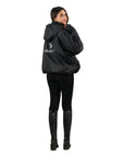 EQUIDRY women's waterproof short blouson style horse riding jacket in black/black studio shot