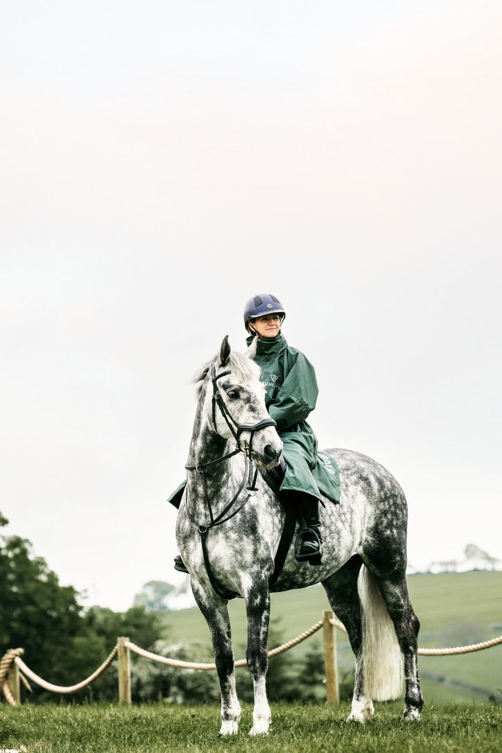 EQUIDRY Black Forest Green Equimac Long waterproof coat  lightweight  raincoat worn by woman horse riding