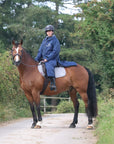 EQUIDRY waterproof horse riding raincoat All Rounder Original thick fleece Women's Navy/Grey rider on horse side view