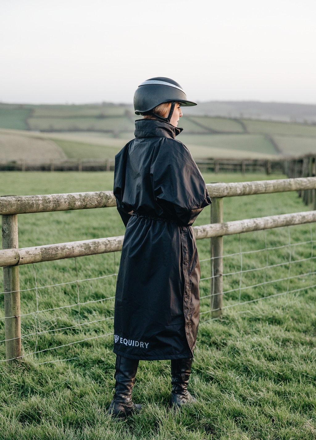 EQUIDRY Black Equimac Long waterproof riding coat  lightweight  raincoat worn by young horse rider