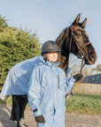 EQUIDRY women's thin fleece stowaway hood long waterproof horse riding coat in sky blue with horse