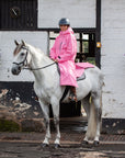 EQUIDRY women's thin fleece long waterproof horse riding coat in penelope pink on horse lifestyle 