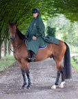 Black Forest Green EQUIDRY Equimac long waterproof raincoat worn by male rider on horse