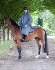 waterproof riding and leisure coat with padded inner detachable faux fur trim equidry in charcoal rider on horse 