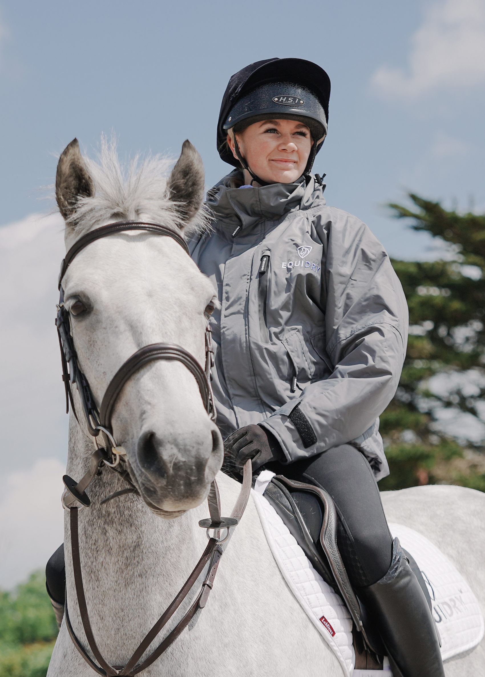 EQUIDRY women's waterproof short blouson style horse riding jacket in charcoal/lilac on horse